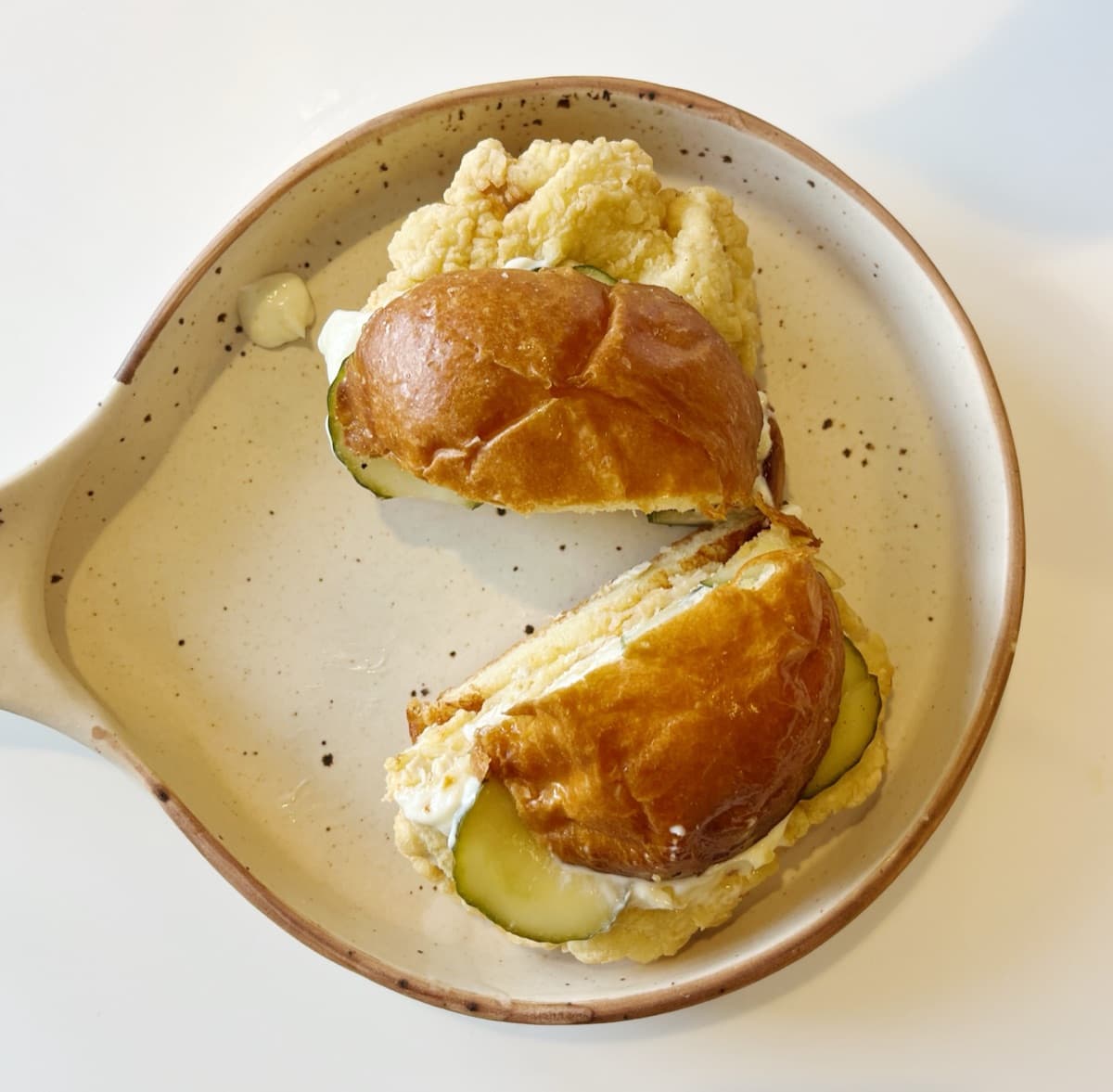 Pretzel-bun sandwiches with pickle and slaw